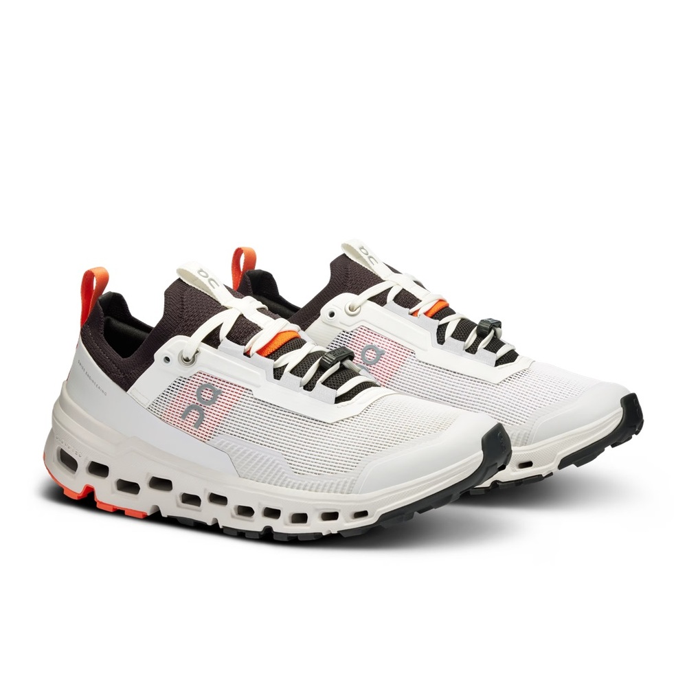 On Running Women's White and Black Athletic Sneakers with Orange Accents